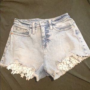Denim shorts with lace trim